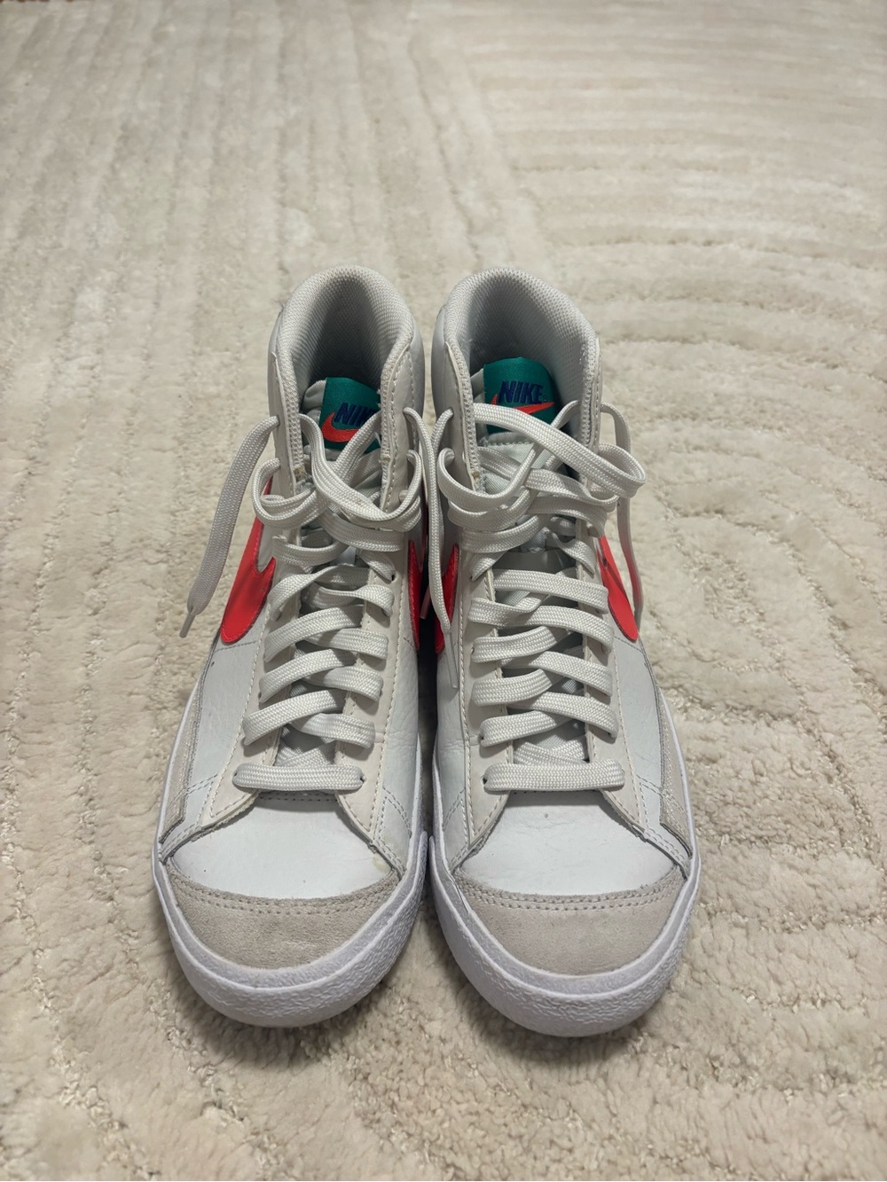 Nike White High-Top Sneakers with Red Swoosh